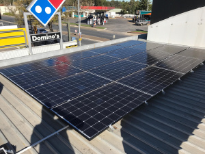 solar panel installation on store's roof.